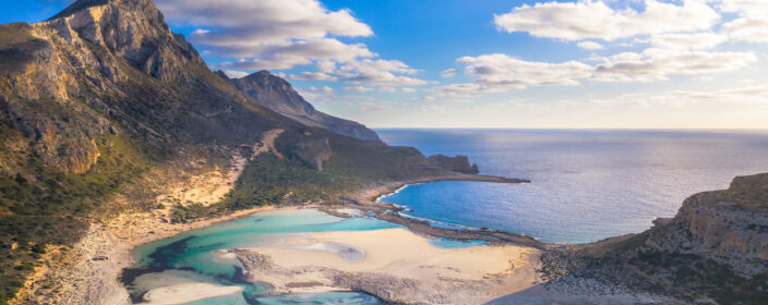 Amazing view of Balos Lagoon with magical turquoise waters, lagoons, tropical beaches of pure white sand and Gramvousa island on Crete, Greece